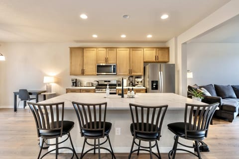 Fully Equipped Kitchen in a Luxury Vacation Rental Cook like a local with stainless steel appliances, ample counter space, and a modern design perfect for entertainment