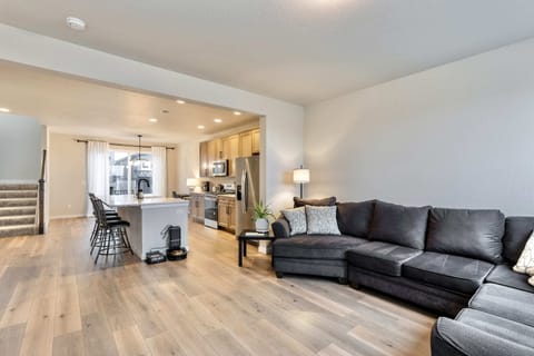 Spacious Living Room with Cozy Seating and Large Windows Unwind in a bright and Airy living space, perfect for relaxation