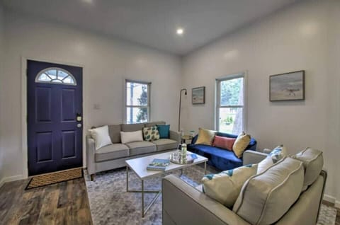 The living room warmly welcomes you with cozy seating and a charming ambiance, perfect for relaxation and enjoyment.