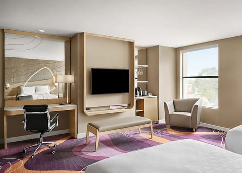 Settle in with spacious seating, big TV, and daylight views.