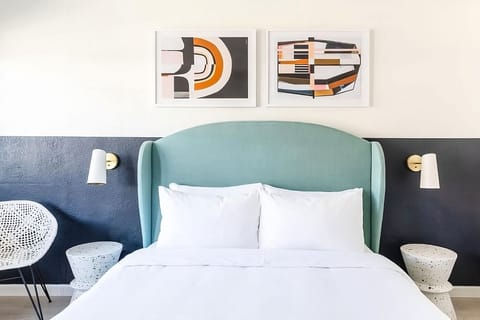 Relax in a beautifully styled bed with soft, layered pillows.
