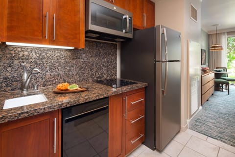 Guest bedroom comes with a well-equipped kitchenette.