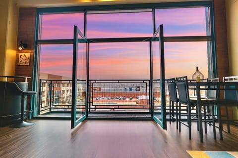 Step into this bright and airy condo where the large patio doors and windows reveal the stunning view of the sky and the pool which is just steps away. Natural light floods the space, creating a warm, welcoming atmosphere perfect for relaxing.