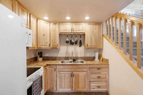Kitchen stocked with pots/pans/dinnerware, basic spices, coffee maker and coffee.