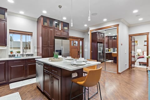 Welcome to our main floor. From the serenity of the master ensuite to the culinary delights of the fully-equipped kitchen and dining area, every corner is designed for your utmost relaxation. A powder room adds a touch of convenience to your stay.