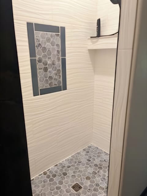 Combined shower/tub, hair dryer, towels, soap