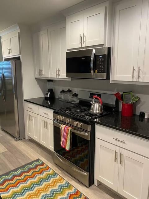 Whip up shared meals or quick snacks effortlessly in this complete kitchen.