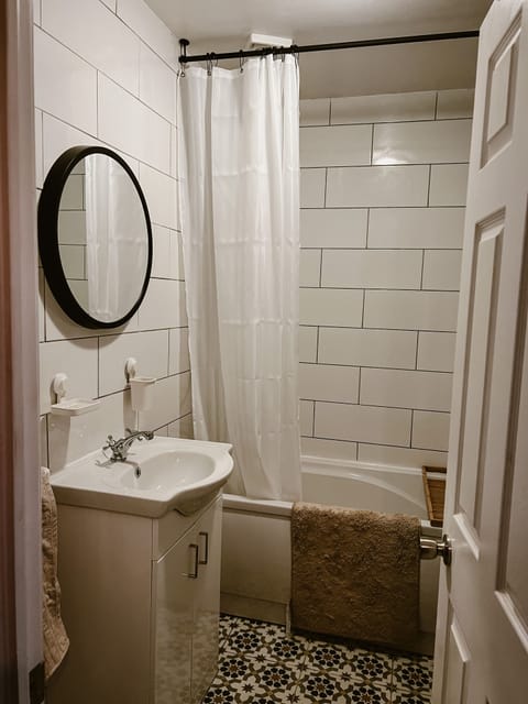 Combined shower/tub, hair dryer, towels, soap