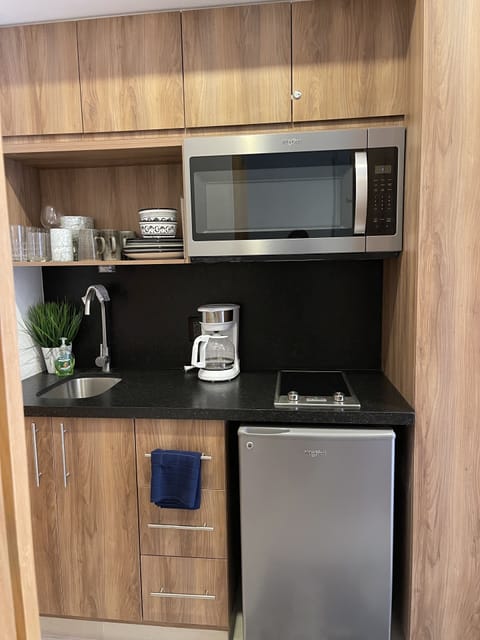 Fridge, microwave, stovetop, coffee/tea maker