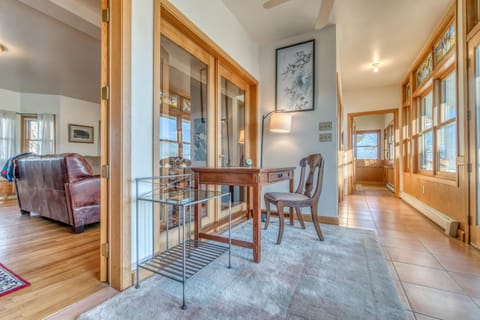 A dedicated workspace off the sun room providing lots of natural light and a cozy space to work in.