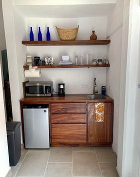 Fridge, microwave, stovetop, coffee/tea maker