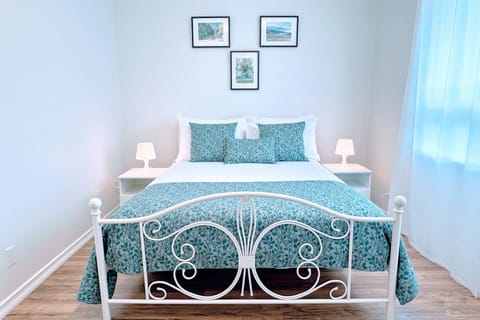 Primary bedroom with premium queen bed