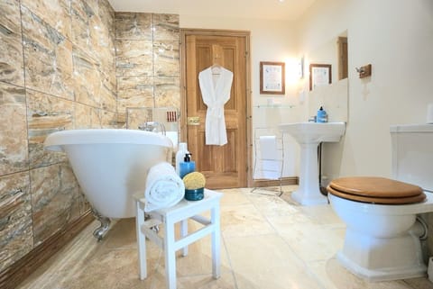 Bathtub, eco-friendly toiletries, hair dryer, towels