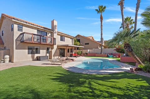 Backyard: Sparkling clean pool is surrounded by desert plants