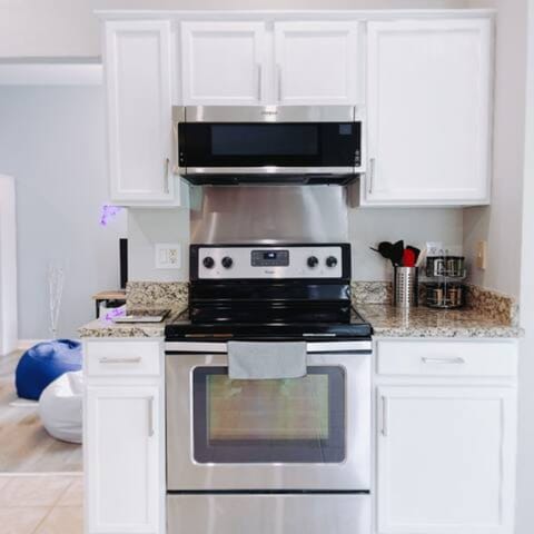 Prepare meals for your loved ones in this fully equipped & stocked open kitchen