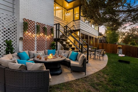 Enjoy a cold drink next to a warm fire while the sun sets over the Rockies