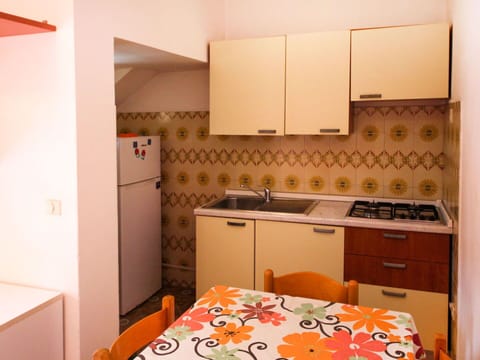 Cabinetry, Property, Furniture, Countertop, Building, Sink, Drawer, Interior Design, Kitchen, Orange