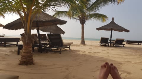 On the beach, sun loungers, beach towels