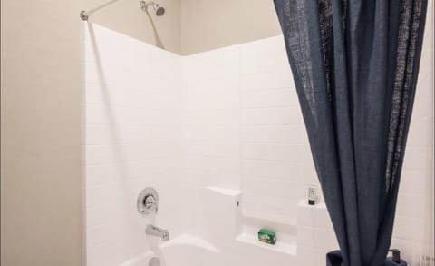 Combined shower/tub, hair dryer, towels, soap