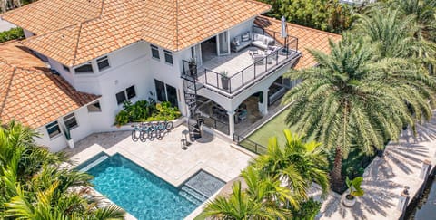 Extravagant Mediterranean coastal waterfront villa is Nestled in the streets of Seven Isles just a mile from the beach.