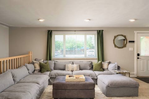 Spacious main living room, perfect for relaxing after a day exploring Denver, watching movies, or gathering as a group.