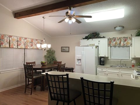 Large table, eat at bar. Plenty room in the fully stocked kitchen.