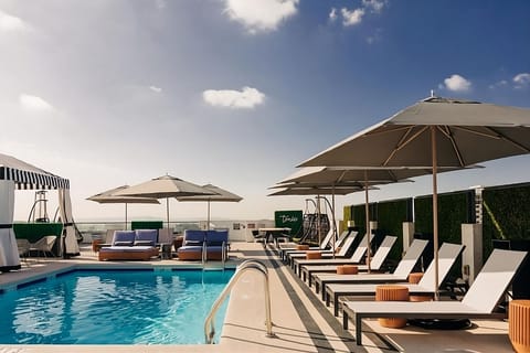 A rooftop pool, sun loungers