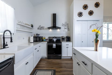 Open kitchen with all utensils and cookware