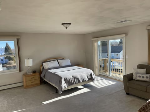 Third floor: Very spacious master bedroom with Juliet balcony and love seat.
