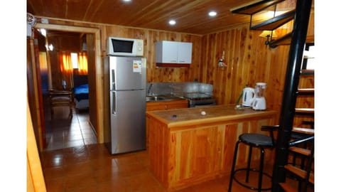 Fridge, toaster, dining tables, kitchen islands