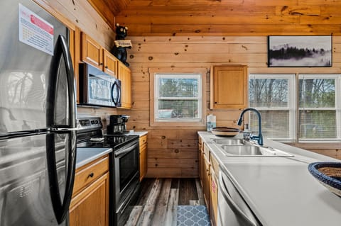 Stocked kitchen w/ stove, fridge, dishwasher, sink, microwave, and coffee maker