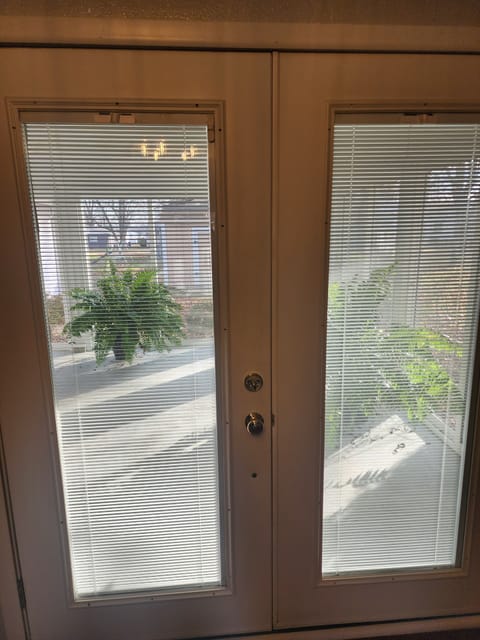 Access to the sunroom through the French doors in the Living room.