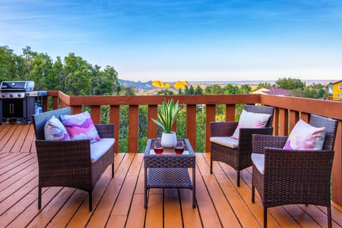 Large deck with a grill, outdoor seating, & amazing views of Garden of the Gods!