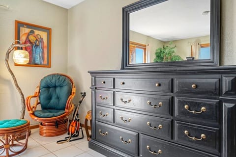 The master bedroom on the main floor w/ deck access & private bathroom!