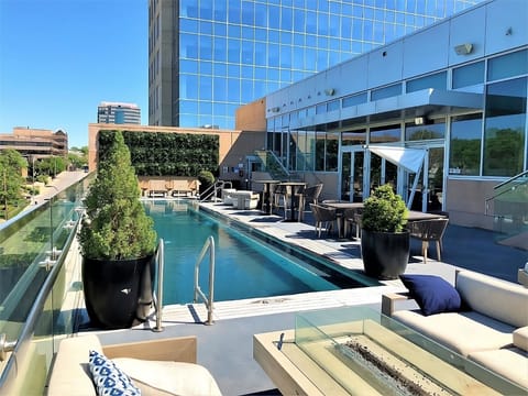 A rooftop pool, sun loungers