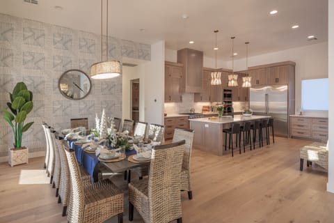 Dining Room and Kitchen - This view of the kitchen, from the living room, shows off the beautifully designed dining and kitchen area that will be a great gathering place for your family and friends.