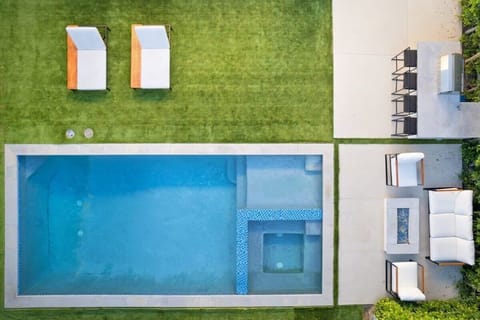 Private outdoor lounge area with pool & spa