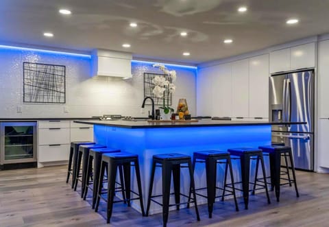 [Kitchen] The Kitchen has Lots of Seating and Large Island, Perfect for Serving a Meal for a Large Group.