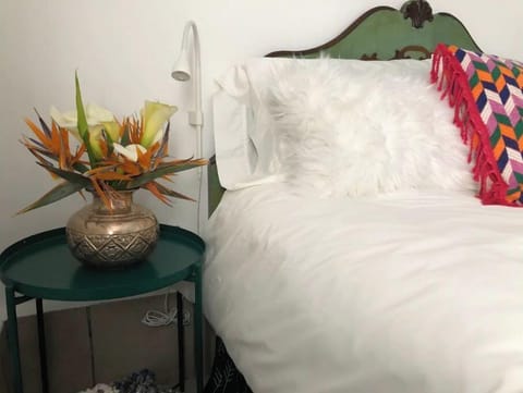 Out bed is a cloud of comfort. Crispy white linens and mayan textiles make it.