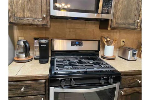 Microwave, dishwasher, coffee/tea maker, cookware/dishes/utensils