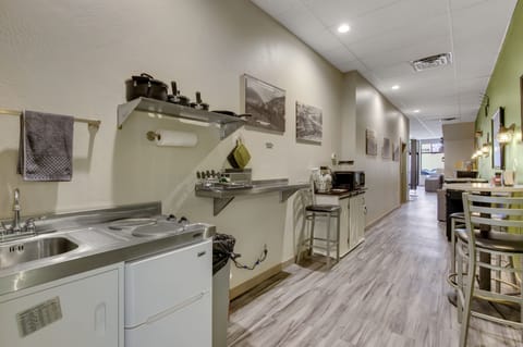 Complete kitchinette, with two burner stovetop, air fryer, microwave, etc.