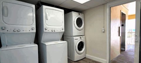 Laundry room by elevator.