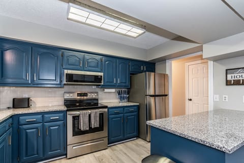 Kitchen with brand new appliances, including dishwasher