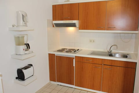 Fridge, stovetop, coffee/tea maker, toaster