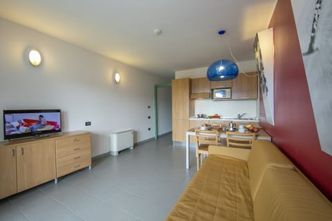 living room with kitchen and dining table view