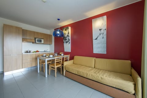 living room with kitchen and dining table view