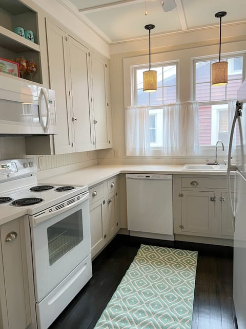 Kitchen comes equipped with microwave, coffee maker, toaster and dishwasher.