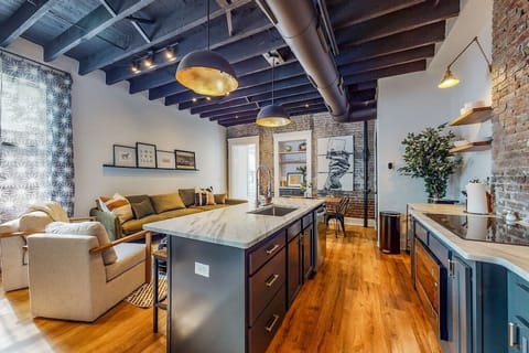 Kitchen: We made sure to design this area with an open layout that connects the living room, dining area, and kitchen, giving the whole space a seamless and roomy feel.