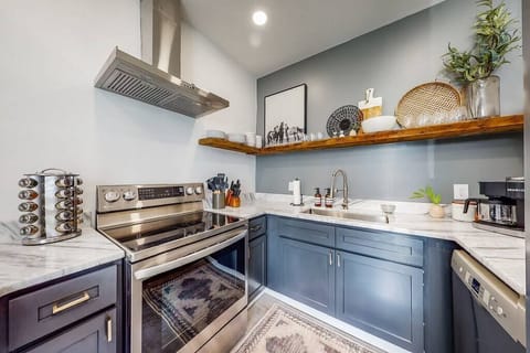 Kitchen: It's equipped with new appliances, including a stove with an oven, refrigerators, and an additional oven.