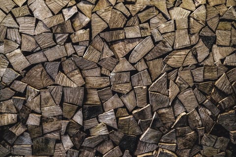 Stacked wood wall by the bar. Just don't pull any of it out...  It's just for ambiance. It's not firewood for burning! LOL...